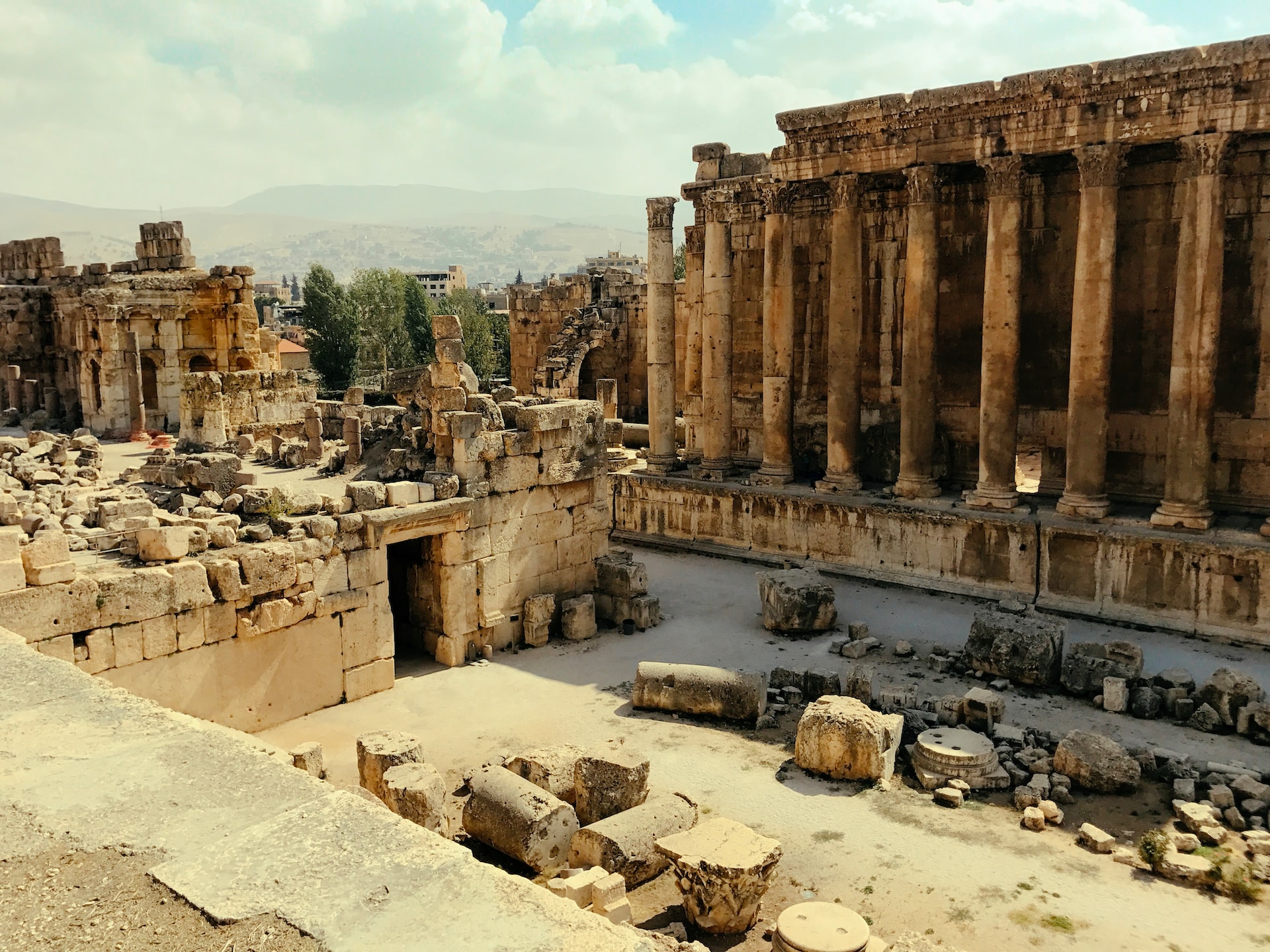 A photo of the impressive ruins of Baalbek, including the Temple of Jupiter, the Temple of Bacchus, and the Temple of Venus, showcasing the Roman Empire's architectural prowess.