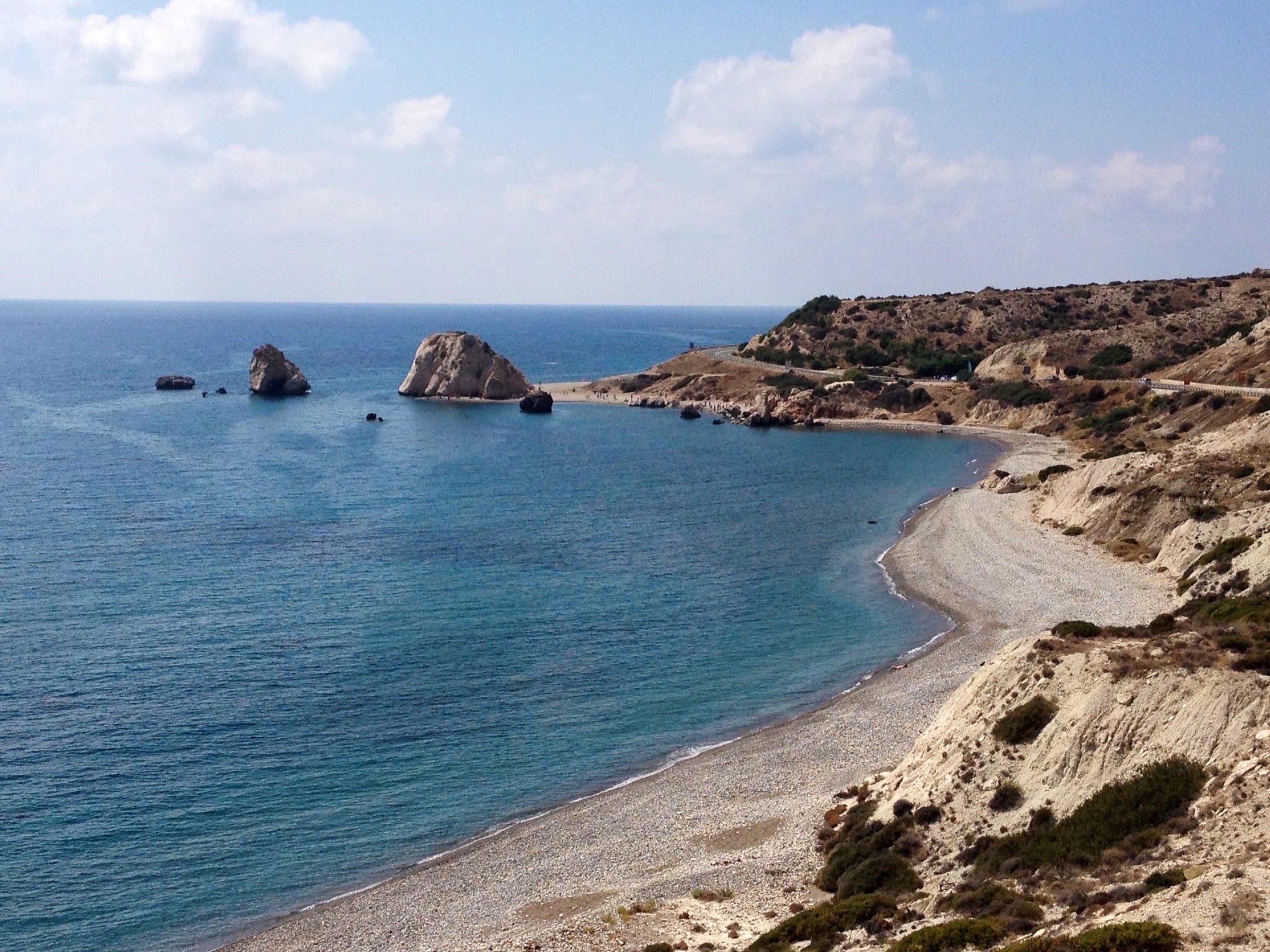 A stunning view of the sea and the rocky coast of Petra tou Romiou, Cyprus.